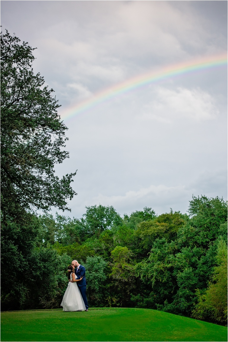 Couple on Wedding Day under Rainbow