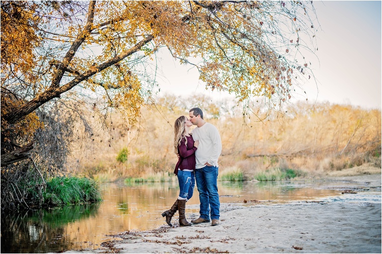 Engagement Photoshoot Couple kissing in Austin Texas by water