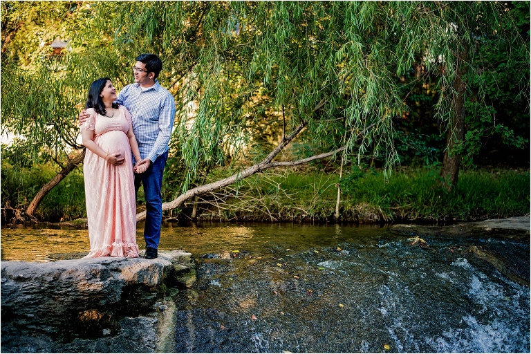 Couple near waterfall Maternity Photoshoot in Austin Texas by Natural Light Photographer