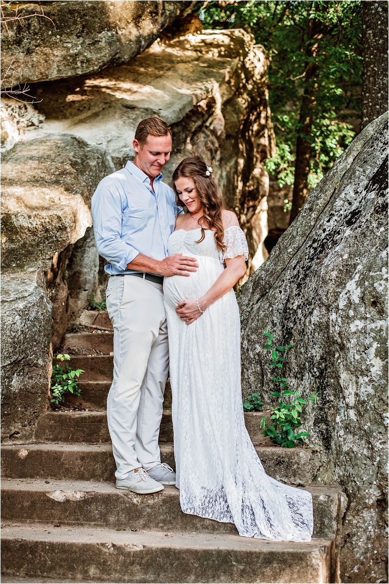 Couple on rock stairs in Austin Texas Maternity Photoshoot by Natural Light Photographer