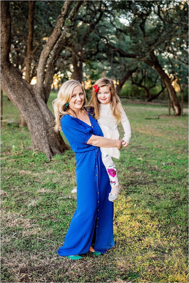 Mother and daughter during family photoshoot for Christmas photos in Leander Texas by natural light portrait photographer