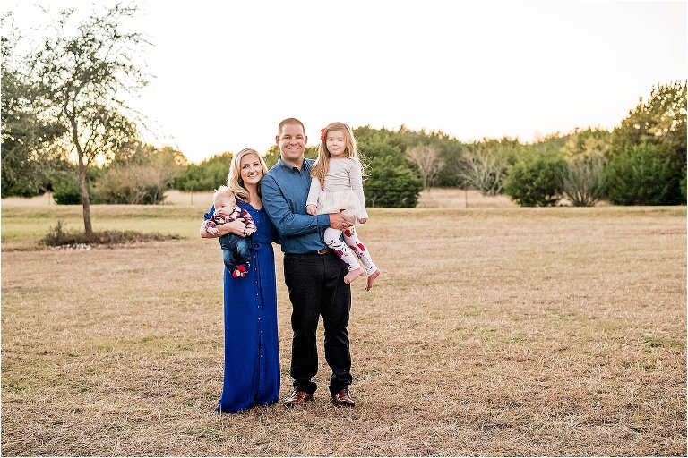 Beautiful family of four in Leander Texas Christmas photoshoot by natural light photographer