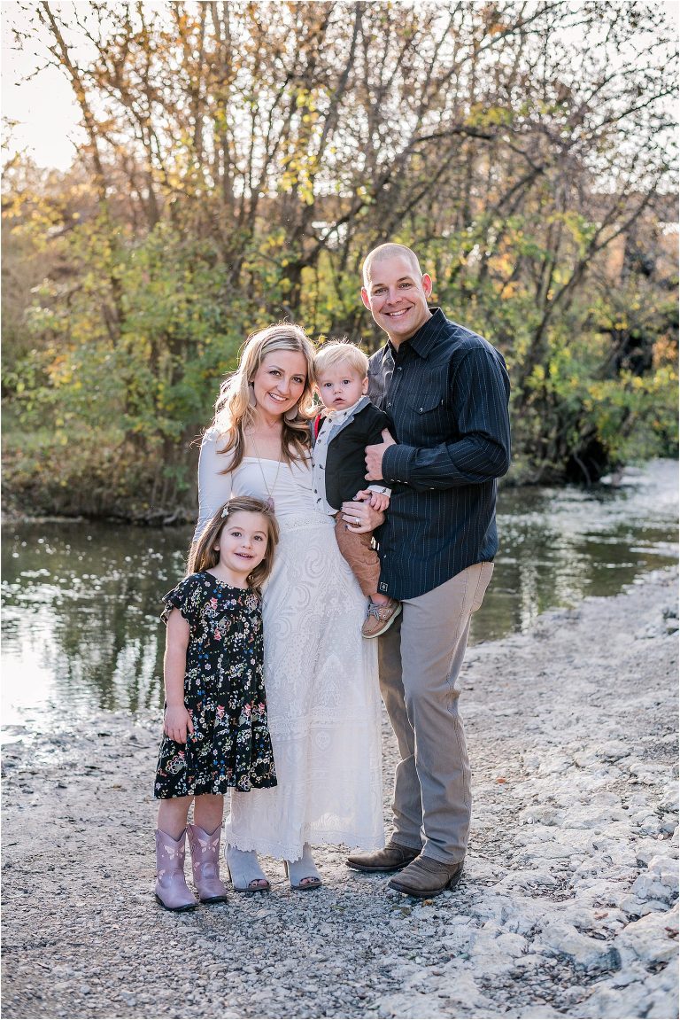 Family of four during Christmas photoshoot in Cedar Park Texas by natural light portrait photographer