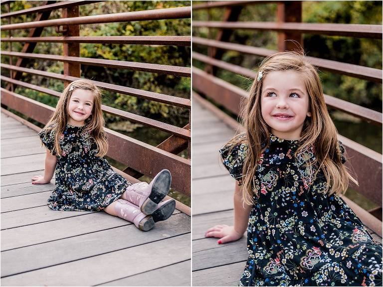 Little girl on bridge during Christmas family photoshoot in Cedar Park Texas by portrait photographer