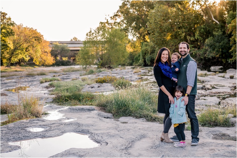 Family of four in Round Rock Texas during morning Christmas photoshoot by natural light portrait photographer