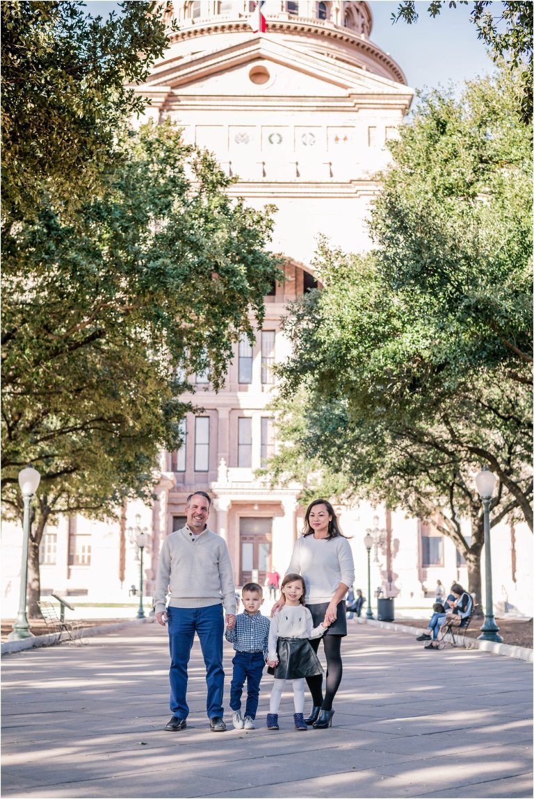 Beautiful family of four at Texas State Capital in Austin TX by natural light family portrait photographer