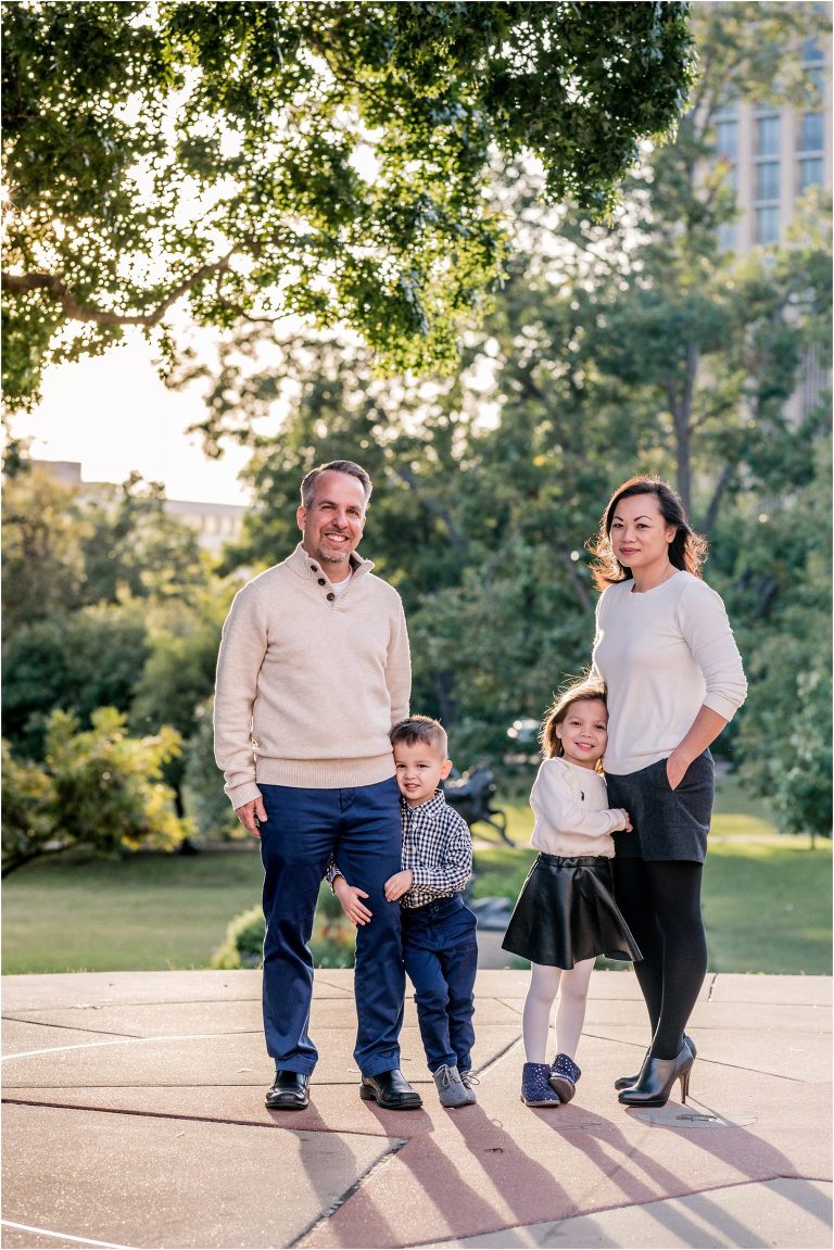 Beautiful family of four at Texas State Capital in Austin TX by natural light family portrait photographer