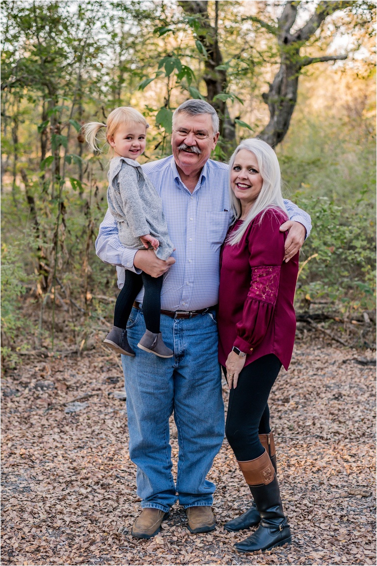 grandparents and granddaughter during family Christmas photoshoot in Round Rock Texas by natural light portrait photographer