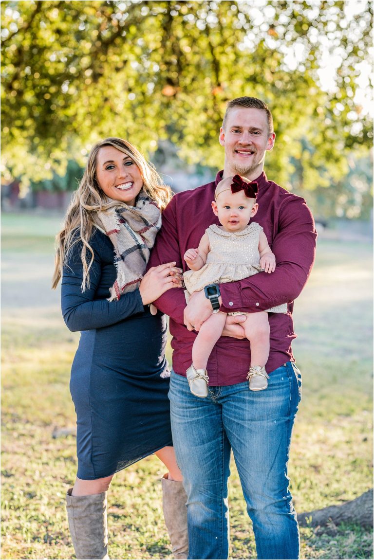 Family of three during Christmas photoshoot in Round Rock Texas by natural light portrait photographer