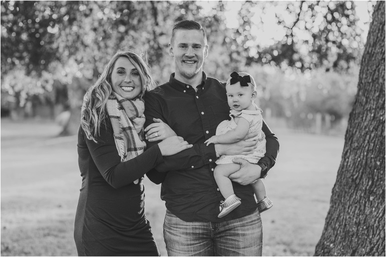 Family of three during Christmas photoshoot in Round Rock Texas by natural light portrait photographer