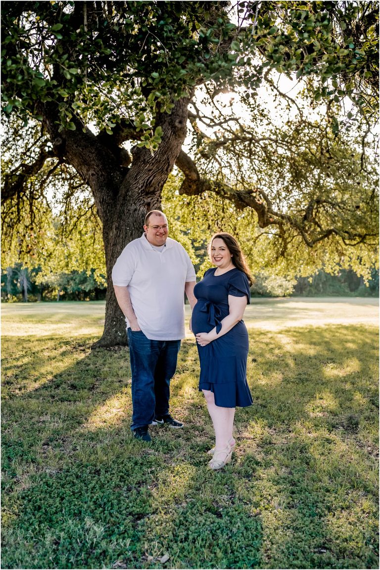 couple snuggled up during sunset maternity session in Round Rock Texas by natural light photographer