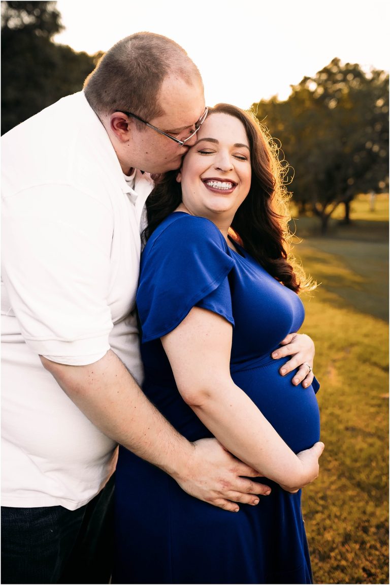 couple snuggled up during sunset maternity session in Round Rock Texas by natural light photographer