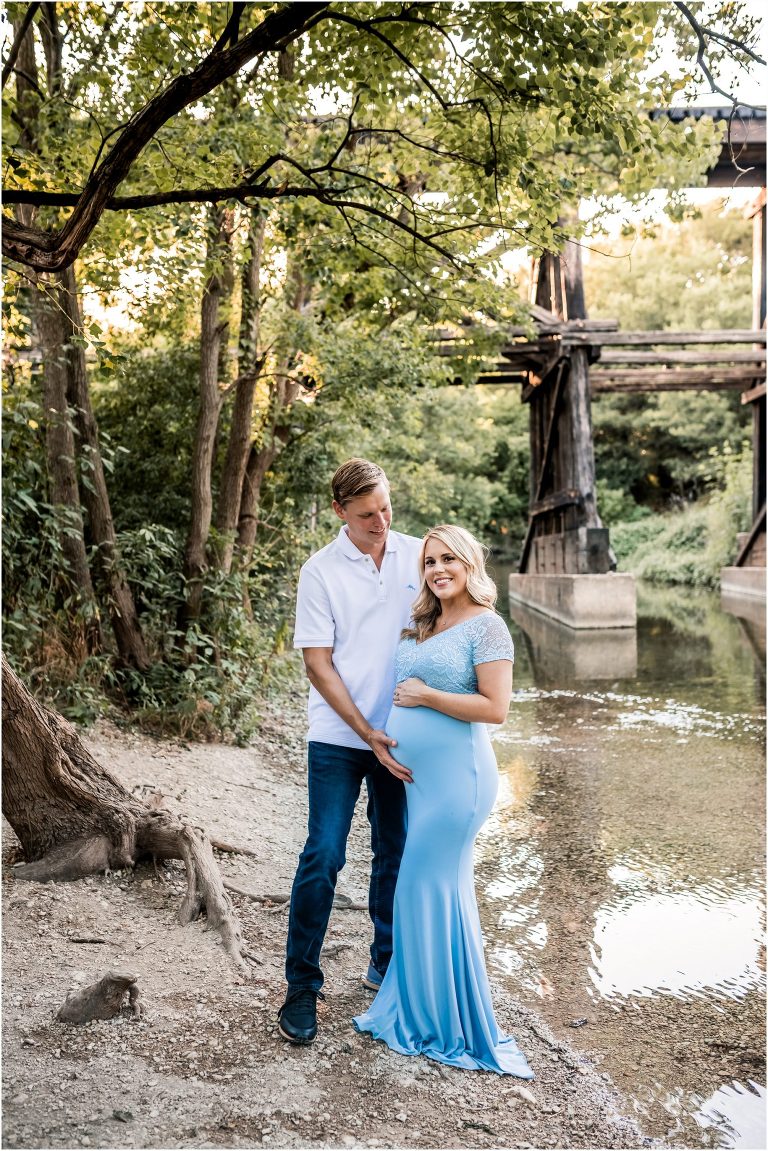 Beautiful couple during maternity photoshoot in Cedar Park Texas next to the creek by natural light portrait photographer