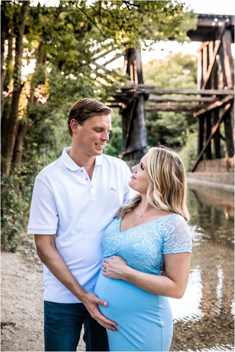 Beautiful couple during maternity photoshoot in Cedar Park Texas next to the creek by natural light portrait photographer