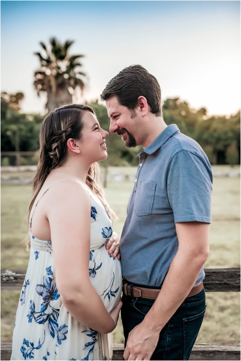 Couple during photoshoot in Pflugerville Texas by natural light maternity portrait photographer