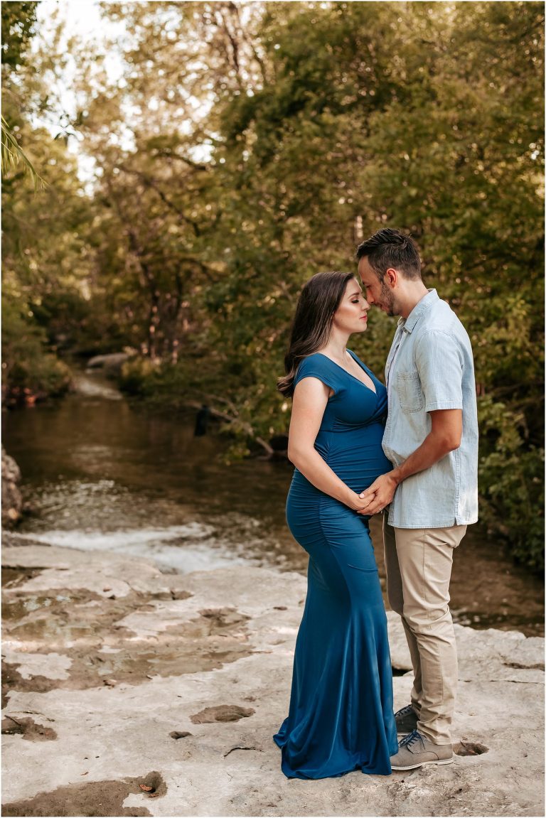 Couple snuggled together during maternity session by natural light photographer in Pflugerville Texas